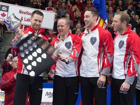 Newfoundland and Labrador's Brad Gushue, left, Mark Nichols, Brett Gallant and Geoff Walker hold the Brier Tankard after defeating Team Canada 7-6 to win the Tim Hortons Brier at Mile One Centre in St. John's on Sunday, March 12, 2017. (Andrew Vaughan/The Canadian Press)