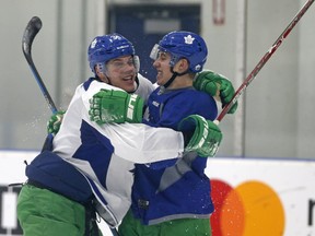 Maple Leafs rookie Auston Matthews hugs Mitch Marner during practice at the MasterCard Centre in Toronto on March 6, 2017. (Michael Peake/Toronto Sun/Postmedia Network)