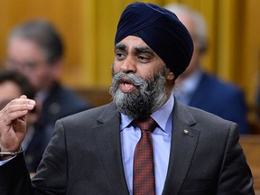 Defence Minister Harjit Sajjan rises during Question Period on Parliament Hill, Friday, March 10, 2017 in Ottawa. THE CANADIAN PRESS/Justin Tang