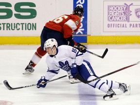 Toronto Maple Leafs' Mitch Marner falls after colliding with Florida Panthers' Jakub Kindl during an NHL game on Dec. 28, 2016, in Sunrise, Fla. (AP Photo/Alan Diaz)