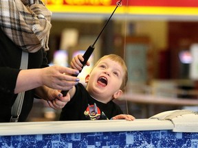 John Lappa/Sudbury Star
Timo Leinala, 3, tries his luck fishing at the Sudbury Game and Fish Protective Association fish pond at the Southridge Mall in Sudbury on Monday. The fish pond will be at the mall until March 19.