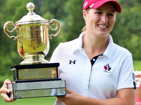 Augusta James holds on to the Duchess of Connaught Trophy after winning the Canadian Women's Amateur Championship in this 2014 file photo. (Postmedia Network file photo)