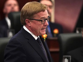 Minister of Education David Eggen introduces Bill 1 after the Speech from the Throne was read by Lieutenant Governor Lois Mitchell during the third session of the 29th Legislature in Edmonton on March 2. The bill outlines the government’s plan to reduce school fees by 25 per cent (Ed Kaiser | Postmedia Network).