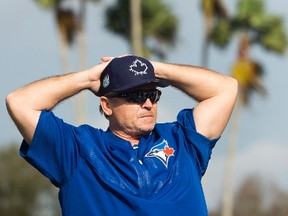 Toronto Blue Jays manager John Gibbons talks with players during spring training in Dunedin on Feb. 15, 2017. (THE CANADIAN PRESS/Nathan Denette)