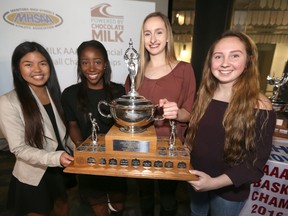 From the left; Kiara Rongavilla, Bettina Shyllon, Taylor Kleysen, and Deidre Bartlett pose with a trophy in Winnipeg today. Tuesday, March 14, 2017. Chris Procaylo/Winnipeg Sun/Postmedia Network