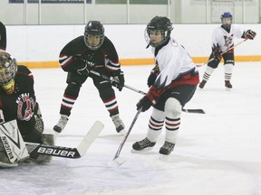 Hawk Evan McLean scores his team’s second goal in the first period against the Kainai Young Braves during a playoff game Saturday at the Vulcan District Arena. Jasmine O’Halloran Vulcan Advocate