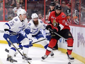 Ottawa Senators' Zack Smith vies for the puck with Tampa Bay Lightning's Adam Erne and Luke Witkowski during an NHL game on March 14, 2017. (THE CANADIAN PRESS/Justin Tang)