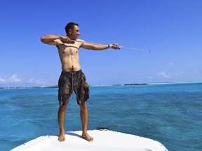 Guide Dreko Chamberlain demonstrates how to use a spear for fishing in the Exumas. STEVE MACNAULL PHOTO