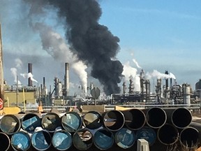 A plume of smoke hangs over the Syncrude Canada Ltd. Mildred Lake Upgrader near Fort McMurray on Tuesday, March 14, 2017. A fire broke out just before 2 p.m and one person was taken to hospital in serious but stable condition. (Supplied photo)