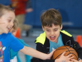Christ the King French immersion kindergarten student Colton Fox plays in the gym on Wednesday, March 8.