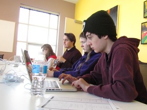 Cole McLean, 14, is at work alongside other students taking part in a March Break workshop at the Judith and Norman Alix Art Gallery in Sarnia. The students were creating a St. Patrick's Day-themed social media campaign. (Paul Morden/Sarnia Observer)