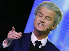Right-wing populist leader Geert Wilders points at Dutch Prime Minister Mark Rutte during a national televised debate at Erasmus University in Rotterdam Monday, March 13, 2017. (Yves Herman POOL via AP)