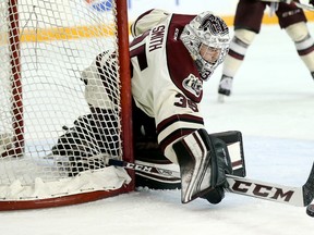 Petes goalie Scott Smith deflects a shot during a recent game against Ottawa 67's  at TD Place Arena. (Wayne Cuddington/Postmedia)