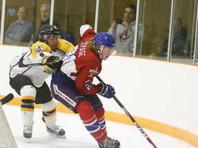 Soo Eagles' Jacob Palmiero chases down Rayside Balfour Canadians' Danny Lepage during first period NOJHL action from the Chelmsford Arena in Sudbury, Ont. on Sunday September 25, 2016. Lepage will lead the Canadians into Game 2 of their NOJHL West Division semifinal on Saturday. Gino Donato/Sudbury Star/Postmedia Network