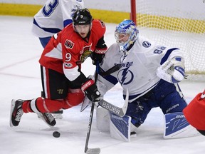 Ottawa Senators' Bobby Ryan tries to gain control of the puck against Tampa Bay Lightning goalie Andrei Vasilevskiy during an NHL game on March 14, 2017. (THE CANADIAN PRESS/Justin Tang)
