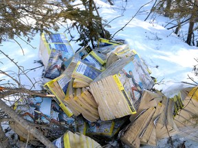 Discarded phone books are scattered on the side of the road and in the bush on Gordon Lake Road in Chelmsford on Tuesday, March 14. John Lappa/Sudbury Star