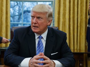 President Donald Trump's revised travel ban was put on hold by Hawaii on Wednesday, several hours before it was to go into effect. (AP Photo/Evan Vucci/Files)