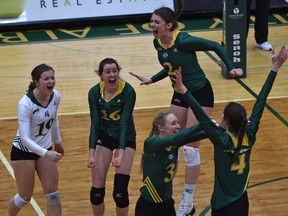 University of Alberta Pandas celebrate after deafeating the UBC Thunderbirds in the gold medal game during the Canada West Women's Final Four volleyball tournament at the Saville Centre in Edmonton, Sunday, March 11, 2017.