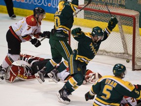 University of Alberta Golden Bears celebrate the game winning goal scored by Stephane Legault (not pictured) against the University of Calgary Dinos during Canada West semi-final game 2 action on Saturday February 25, 2017 at Clare Drake Arena in Edmonton.