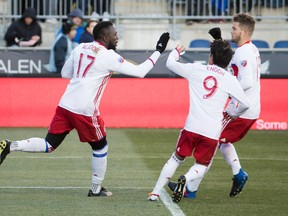 Toronto FC’s Jozy Altidore (left) celebrates his penalty kick goal with Tsubasa Endoh and Eriq Zavaleta during their game  against the Philadelphia Union last week. (AP)