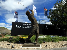 A view of the new 13-foot-tall Arnold Palmer statue situated by the first tee at Bay Hill, where the first Arnold Palmer Invitational will be held since the King passed away. (The Associated Press)