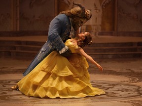 This image released by Disney shows Dan Stevens as The Beast, left, and Emma Watson as Belle in a live-action adaptation of the animated classic "Beauty and the Beast." (Disney handout)