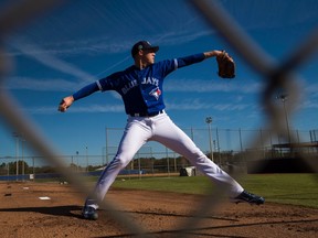 Toronto Blue Jays starting pitcher Aaron Sanchez thows a bullpen session during baseball spring training in Dunedin, Fla., on Friday, February 17, 2017. THE CANADIAN PRESS/Nathan Denette