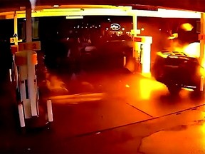 A Nissan X-Terra crashes into the pumps at a Seattle gas station. (YouTube screengrab)