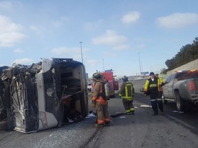 A coach bus lies on its side on Highway 401 at Bathurst St. on Thursday, March 16, 2017. (@SonnySubra)