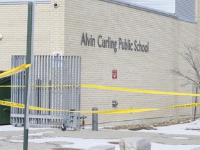 Police tape at the scene next to Alvin Curling Public School on Thursday, March 16, 2017 after a man was found dead. (Veronica Henri/Toronto Sun)