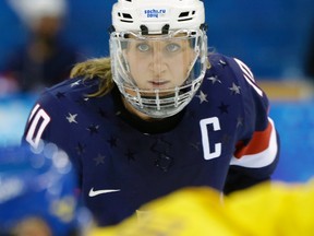 In this Feb. 17, 2014, file photo, Meghan Duggan of the United States looks up during a face off during the second period of the 2014 Winter Olympics women's semifinal ice hockey game against Sweden at Shayba Arena in Sochi, Russia. (AP photo)