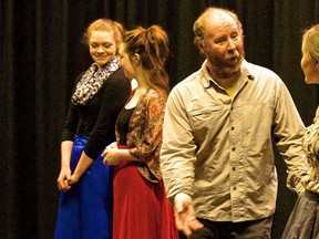 From left are: Maddie Budding as Jane Bennet, Rylee Bremner as Charlotte Lucas, Marvin Tucker as Sir Lucas, and Maija Thompson as Elizabeth Bennet in rehearsal for Pride and Prejudice.
