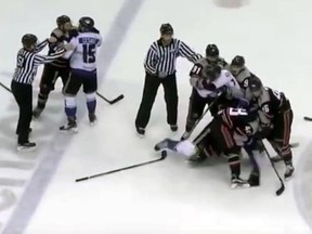 Jason Price of the Knoxville Ice Bears defends himself after hitting a trainer with the puck (YouTube screen grab)