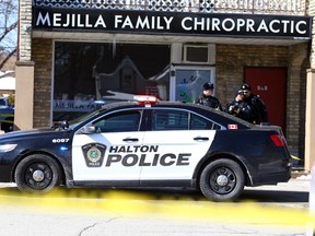 Halton Police investigate the scene at the Mejilla Family Chiropractic clinic in Burlington after two people were shot on Thursday March 16, 2017. Dave Abel/Toronto Sun