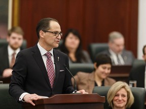 Alberta Finance Minister Joe Ceci (left) alongside Premier Rachel Notley (right) speaks as he tables Budget 2017 in the Alberta Legislature in Edmonton on Thursday, March 16, 2017.