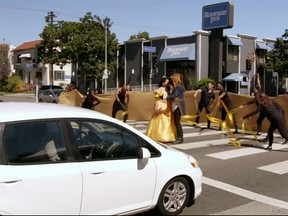 James Corden and the stars of 'Beauty and the Beast' stopped traffic in West Hollywood on Wednesday  to perform segments of the musical on a crosswalk. (YouTube screengrab)