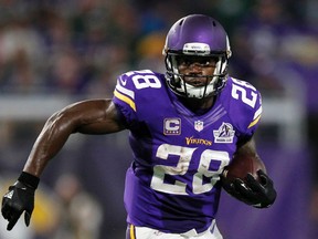 In this Sept. 18, 2016, file photo, Minnesota Vikings running back Adrian Peterson carries the ball during the team's NFL football game against the Green Bay Packers in Minneapolis. (AP Photo/Andy Clayton-King, File)
