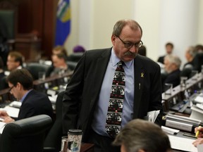 PC leader Ric McIver is seen as members read the budget as Alberta Finance Minister Joe Ceci tables Budget 2017 in the Alberta Legislature in Edmonton on Thursday, March 16, 2017. Ian Kucerak / Postmedia