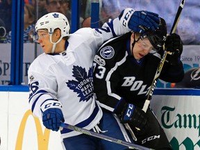 Nikita Soshnikov of the Toronto Maple Leafs checks Adam Erne of the Tampa Bay Lightning during an NHL game at the Amalie Arena on March 16, 2017. (Mike Carlson/Getty Images)
