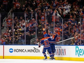 Edmonton Oilers Matthew Benning and Patrick Maroon celebrate Maroon's first goal against the Boston Bruins in Edmonton on Thursday, March 16, 2017. (David Bloom)