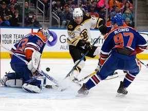 Edmonton Oilers goalie Cam Talbot and Connor McDavid stop the Boston Bruins' David Pastrnak in Edmonton on Thursday, March 16, 2017. (David Bloom)