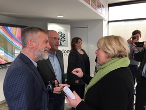 Deputy premier Deb Matthews and Youth Opportunities Unlimited executive director Steve Cordes discussed homelessness funding after an announcement in London Friday. RANDY RICHMOND/THE LONDON FREE PRESS