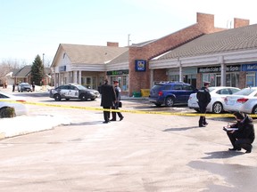 Police investigate the assault of an employee at the RBC in Huntington Square on Martindale Avenue on Friday March 17, 2017 in St. Catharines, Ont. Karena Walter/St. Catharines Standard/Postmedia Network