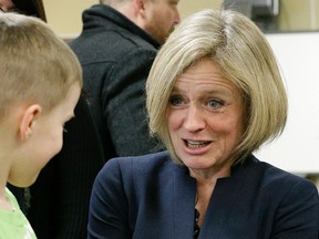 Alberta Premier Rachel Notley holds a lizard at Monsignor Fee Otterson School in southwest Edmonton on Friday March 17, 2017. (PHOTO BY LARRY WONG/POSTMEDIA)