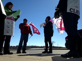 Striking workers with the Canadian Hearing Society picket in front of the Kingston office in Kingston, Ont. on Friday, March 17, 2017. 
Elliot Ferguson/The Whig-Standard/Postmedia Network