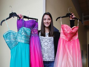 Daniela Cino, founder of Dresses 4 Prom, is looking to collect 150 dresses by March 31, 2017 to help local Grade 12 students get a dress for their prom, seen here with a few donations in Kingston, Ont. on Thursday March 16, 2017. Julia McKay/The Whig-Standard/Postmedia Network