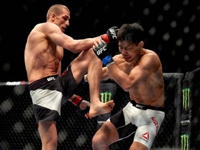 Tom Breese competes against Keita Nakamura in a welterweight bout at the UFC Fight Night event in London on Feb. 27, 2016. (NIKLAS HALLE'N/AFP/Getty Images)