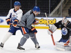 (Left to right) Edmonton's Darnell Nurse, Iiro Pakarinen and goaltender Laurent Brossoit drill during an Edmonton Oilers practice at Rogers Place in Edmonton on Friday, March 17, 2017