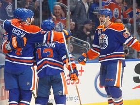 Edmonton Oilers' Zack Kassian (44), David Desharnais (13) and Benoit Pouliot (67) celebrate a goal against the Dallas Stars during second period NHL action in Edmonton, Alta., on Tuesday, March 14, 2017.