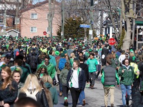 Masses of St. Patrick's Day revellers move along Aberdeen Street from Earl Street to Johnson Street near Queen's University in Kingston. (Steph Crosier/Whig-Standard file photo)